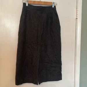 100% wool pencil skirt.  Slit front with pockets.  Very classy-
